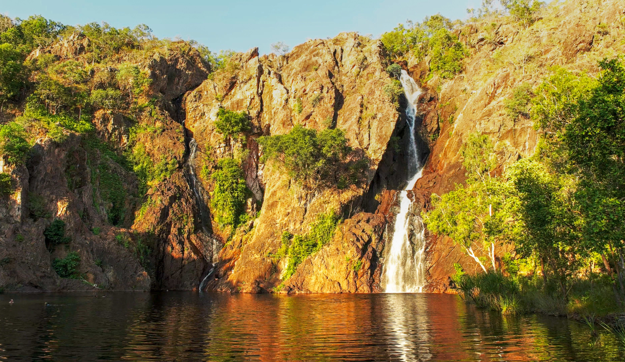 A water fall flowing into a pool of water at Kakadu National Park.