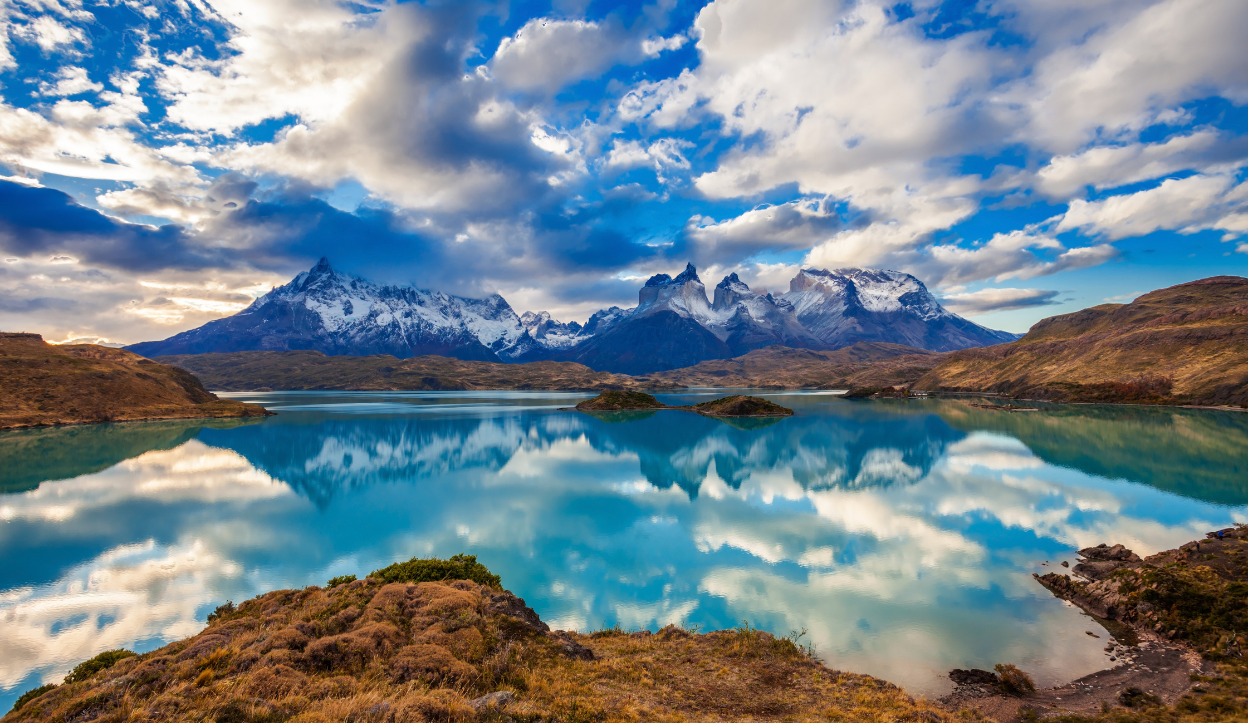 Reflecting mountains off a lake inside Torres del Paine National Park