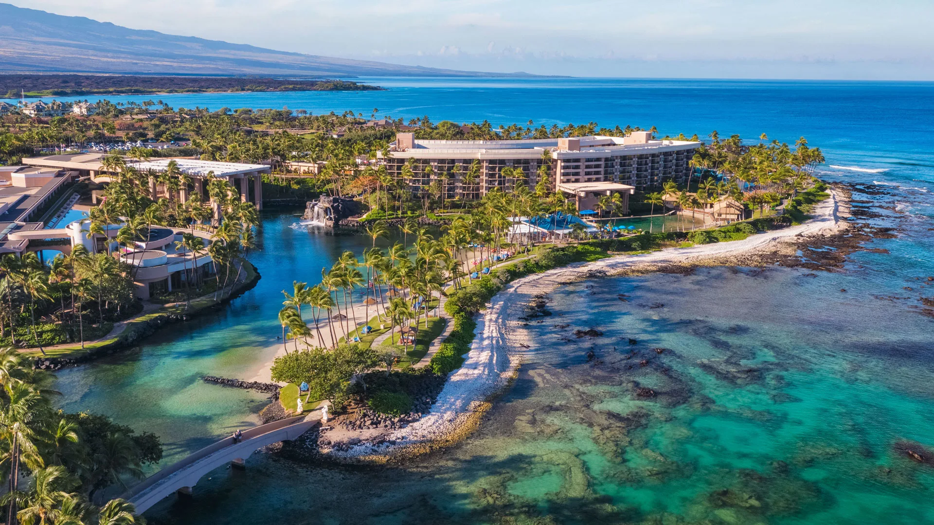 Ariel View of Hilton Waikoloa Village with beautiful clear blue water and coral reefs.
