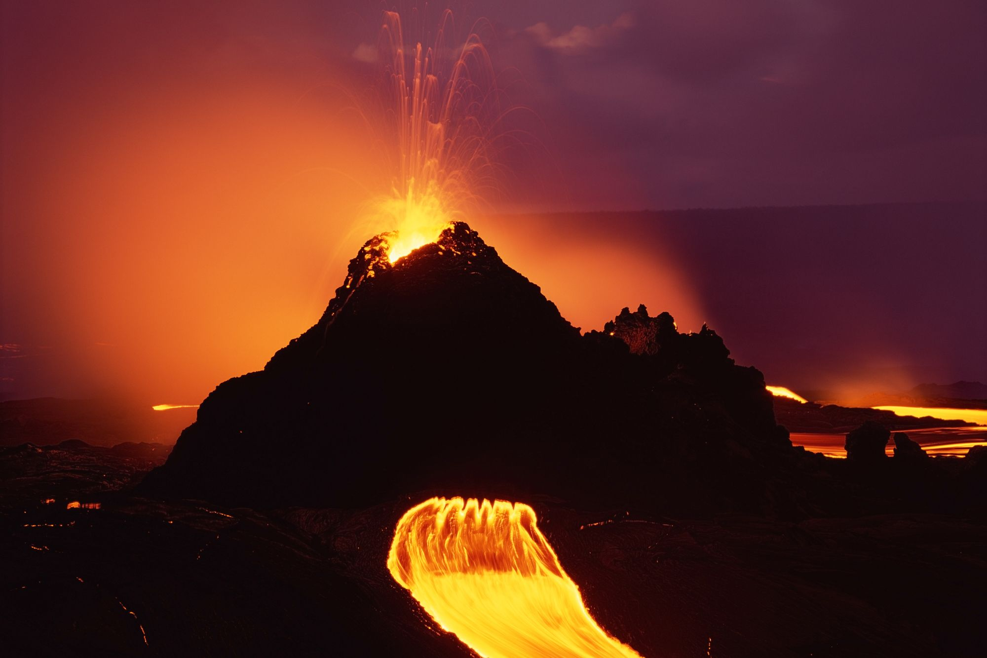 Kilauea volcano erupts spewing hot lava down the side of the volcano.