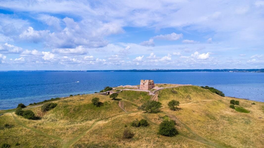 Castle ruins on a hilltop overlooking the ocean at Mols Bjerge in Denmark.