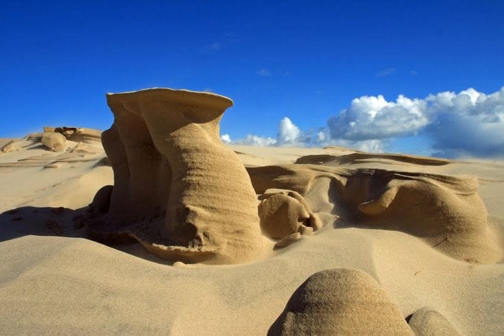 Rock formations and sand dunes at Råbjerg Mile in Denmark.