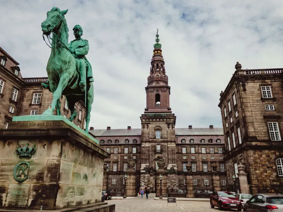 Statue of a man on a horse at the entrance of the Christiansborg Palace in Copenhagen.