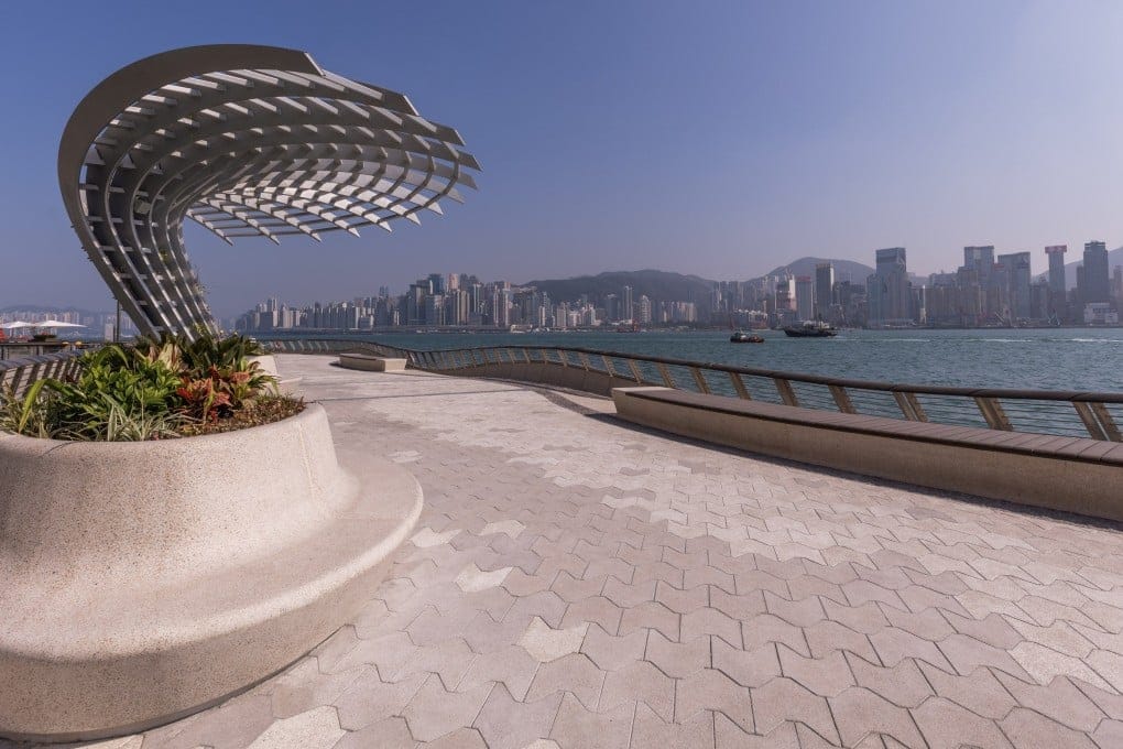 Waterfront viewing area with city view of Hong Kong from Tsim Sha Tsui Promenade.