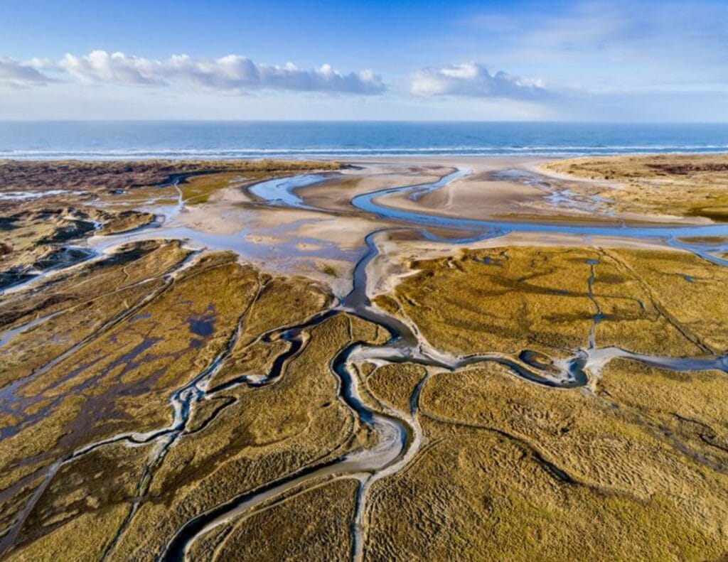 Tributary at Wadden Sea National Park In Denmark at low tide.