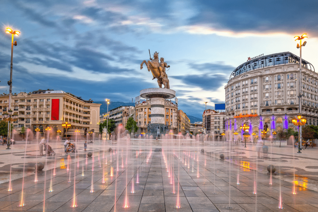 City center square showing a man on a horse statue in Skopje.