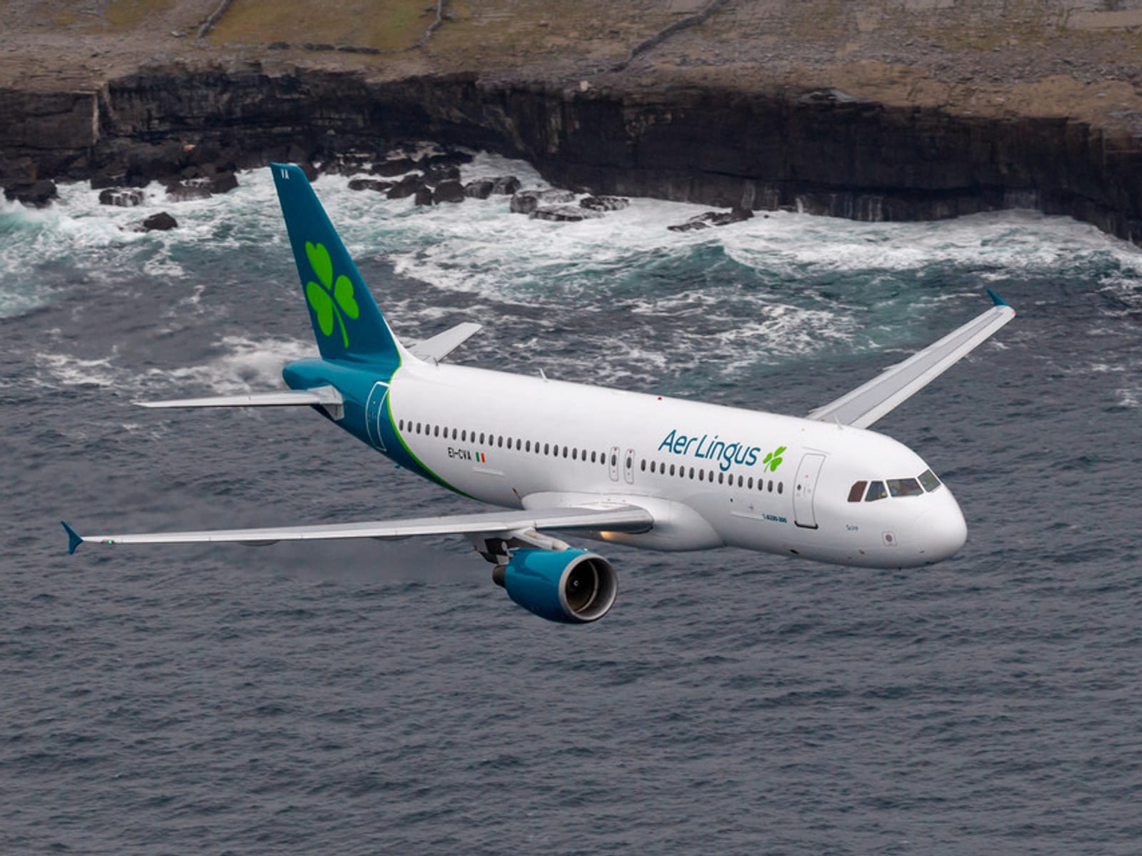 An Aer Lingus Airplane over the ocean about to land in Ireland from Seattle, Washington.