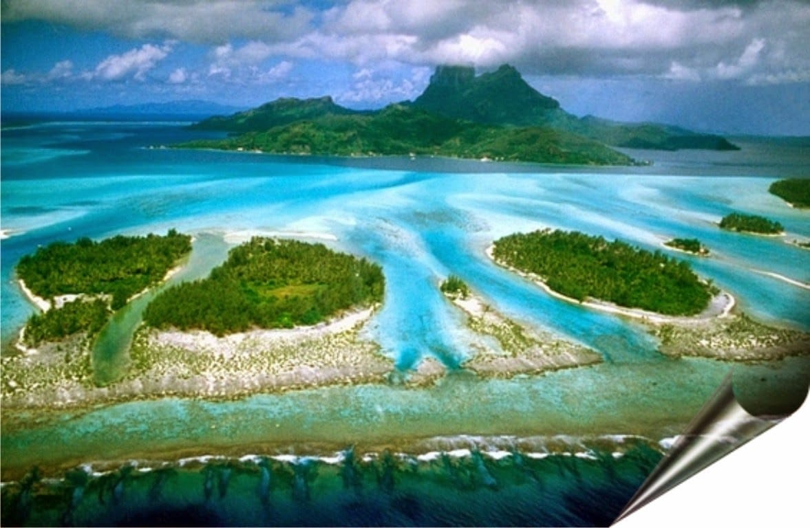 Ariel view of crystal clear waters and beaches of Derawan Islands in Borneo.