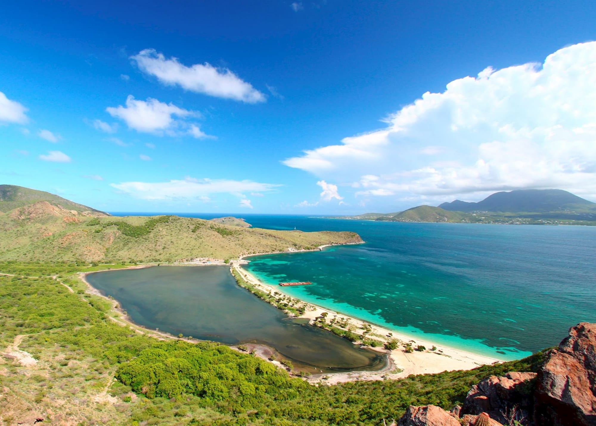 View of a beach with beautiful clear waters at Majors Bay Beach in St. Kitts.