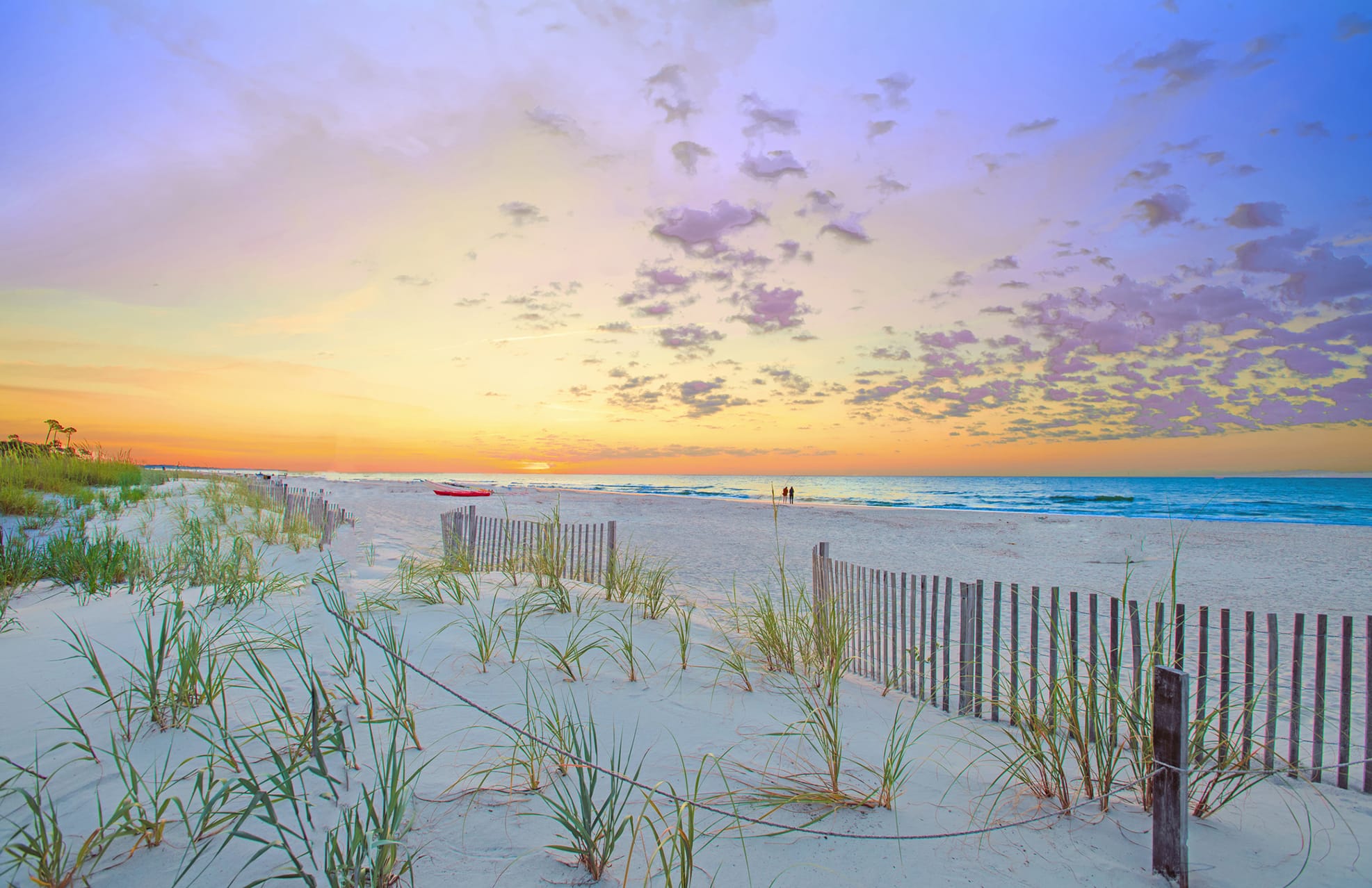 Scenic aerial image of Mitchelville Beach on Hilton Head Island, South Carolina, with bridges over tidal creeks, coastal marshlands, and a long stretch of white sand beach.