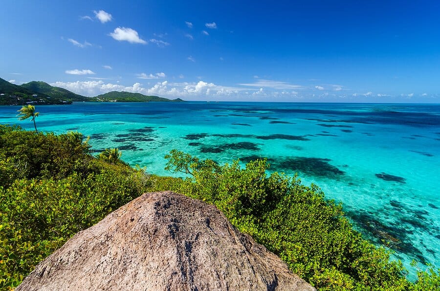 Vibrant turquoise waters and coral reefs off the coast of Old Providence Island in Colombia.