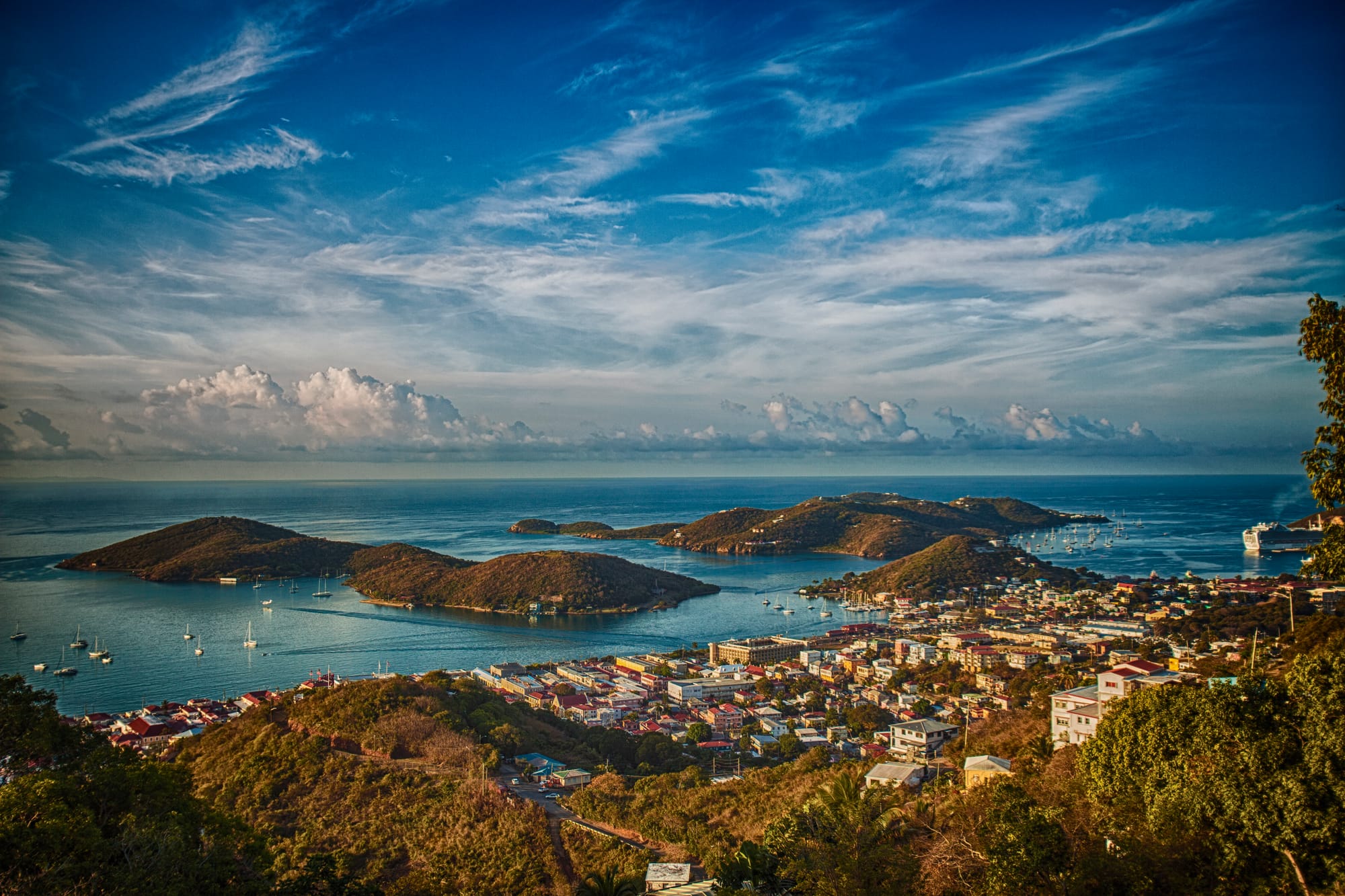 Beautiful ariel view of East End of St. Thomas showing mountainous islands and sailboats anchored near the shore.