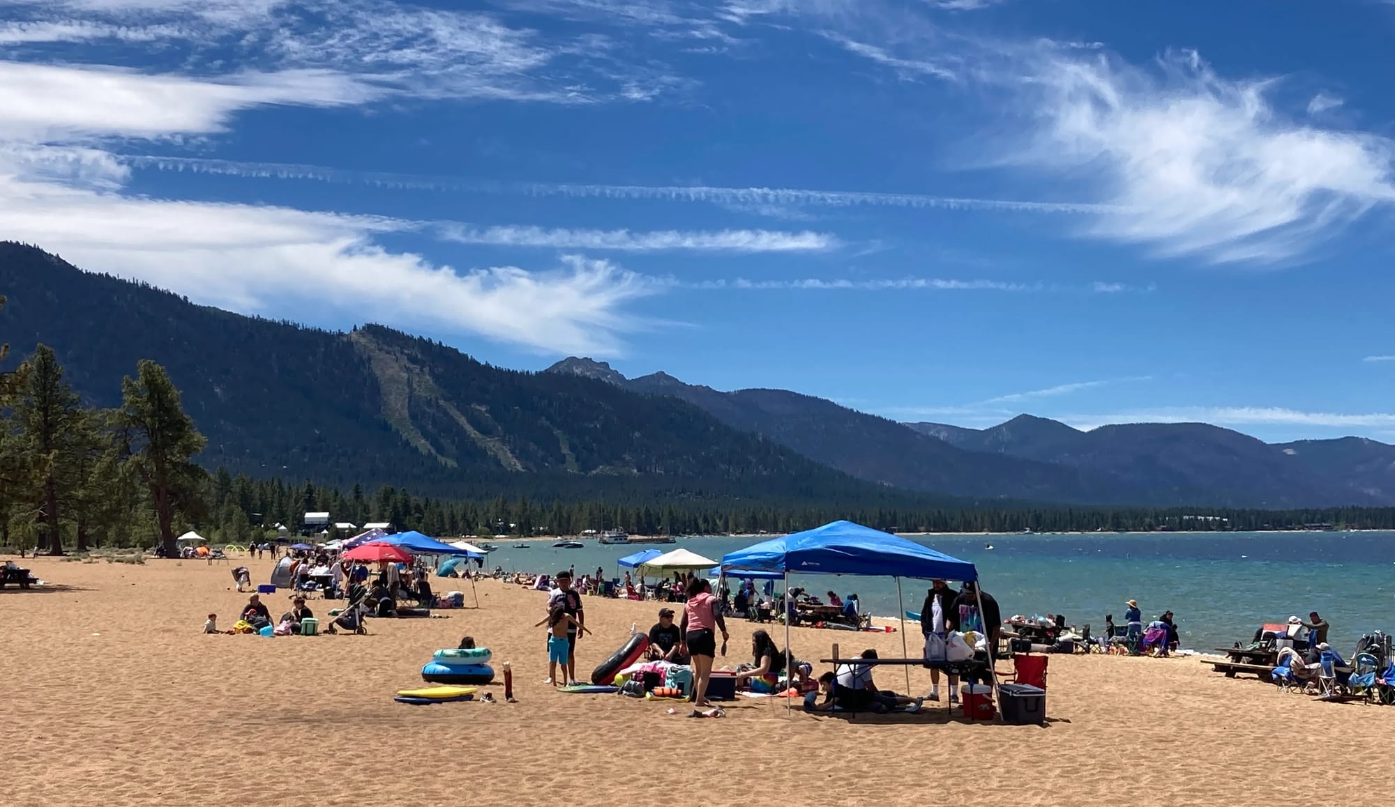 People enjoying Nevada Beach on a summer day in Lake Tahoe