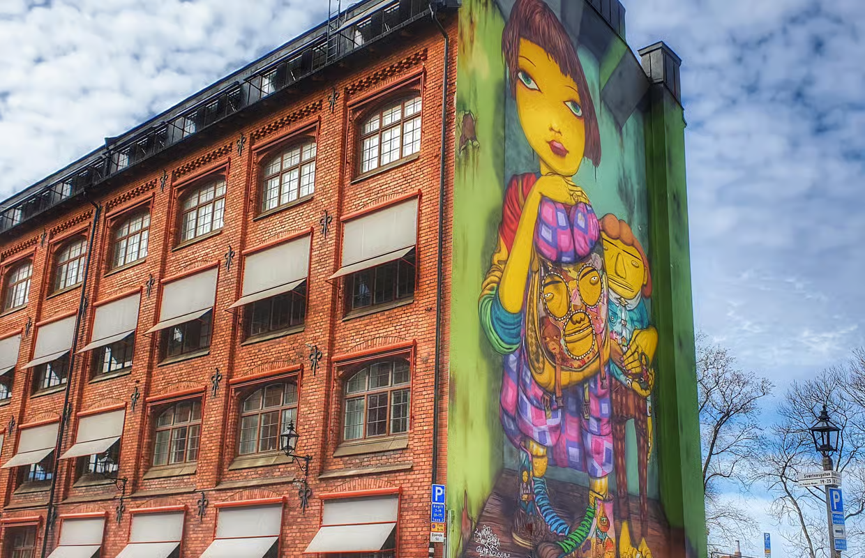 Colorful Art work on the side of an old brick building in Södermalm Stockholm, Sweden.
