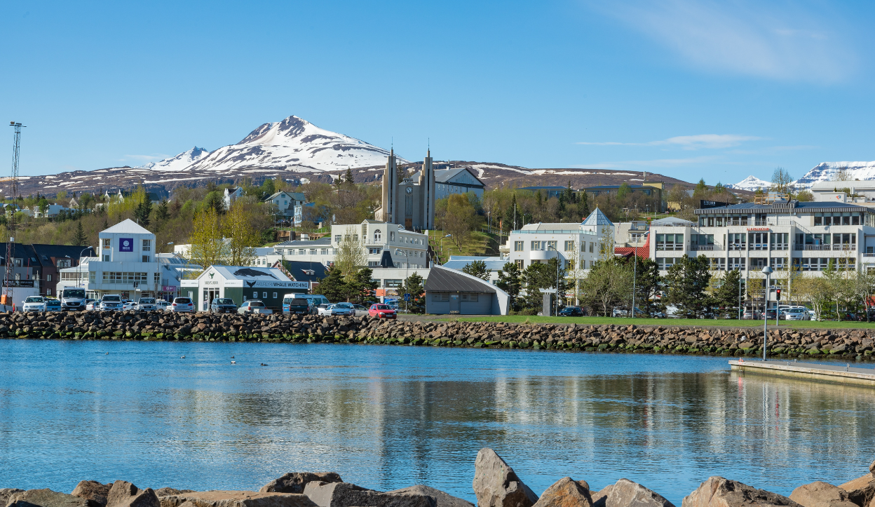 View of a mountain peak sitting behind the town of Akureyri, Iceland.