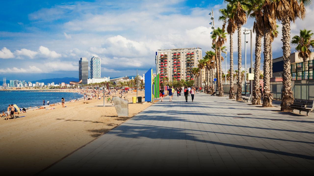 The beach boardwalk in La Barceloneta neighborhood in Barcelona, which is one of the best areas for visitors to stay in.