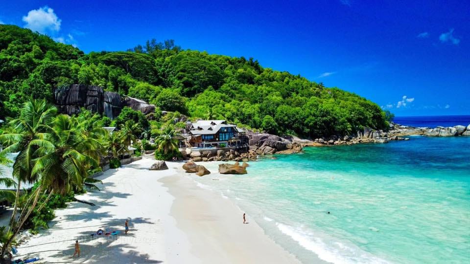 Anse Takamaka in Mahé Seychelles is a gorgeous beach with clear waters and beautiful views.