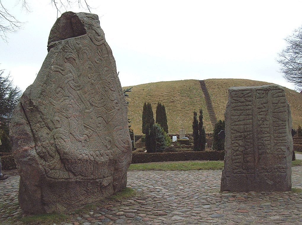 Old large stone hat have ancient engravings on them at Jelling Stones & Viking Monuments, a UNESCO site.