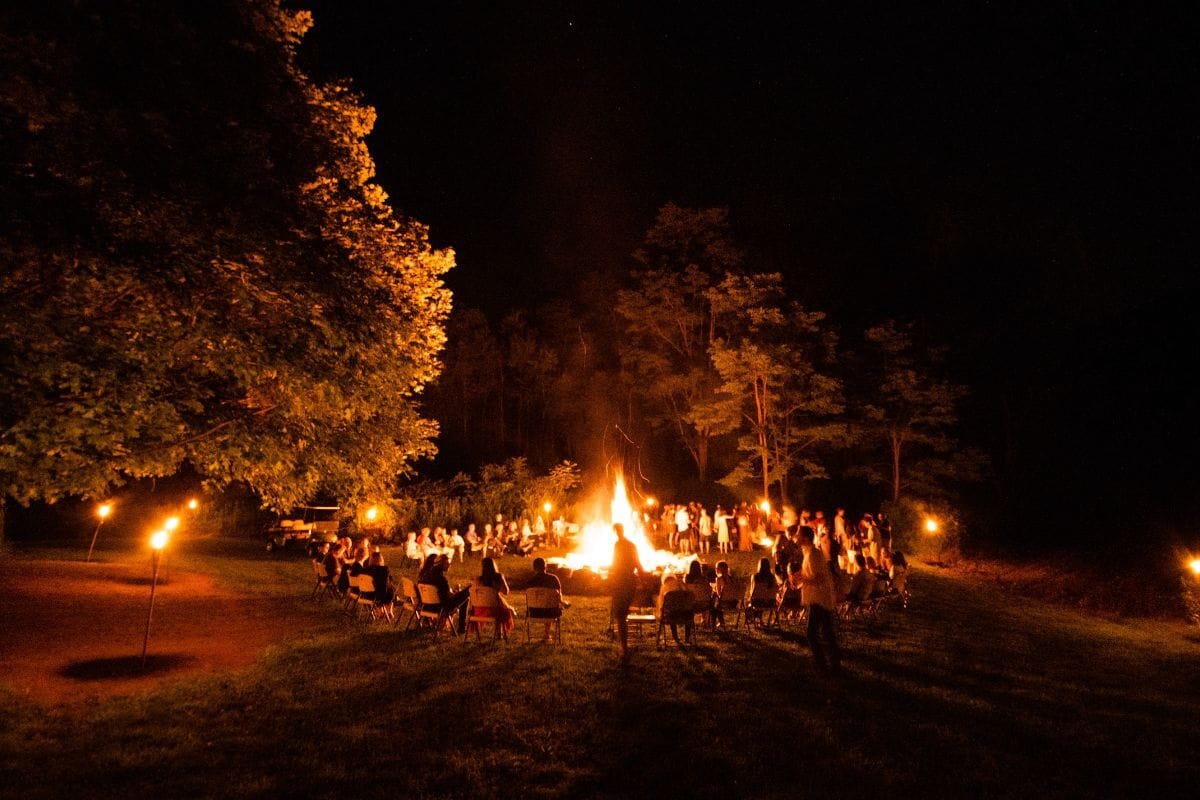 People sitting around a large bonfire in Copenhagen for Midsummer’s Eve (Sankt Hans Aften).