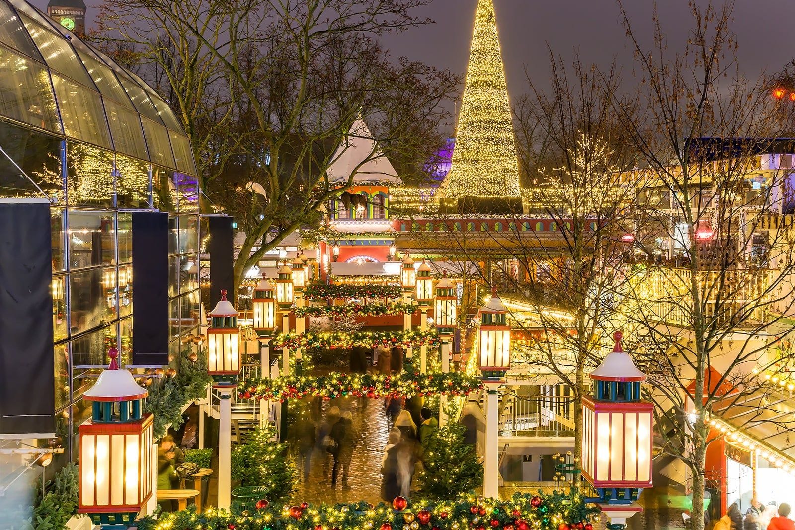 Tivoli Gardens Christmas market (Jul i Tivoli) with the big cone-shaped light “tree” and the decorated walkways.