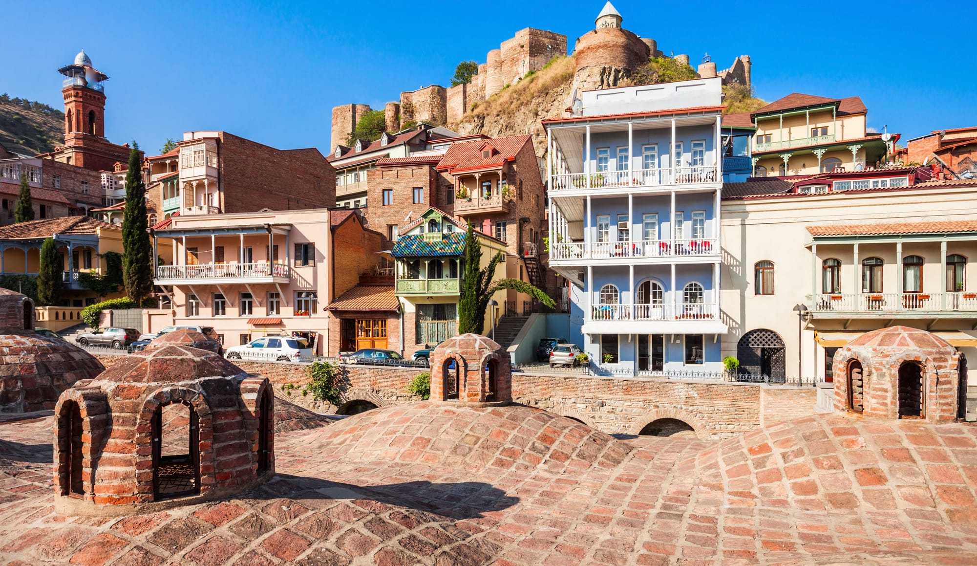 Abanotubani sulfur bath district (those brick domes in the foreground are the famous bathhouse roofs), with Narikala Fortress up on the hill behind the old town.