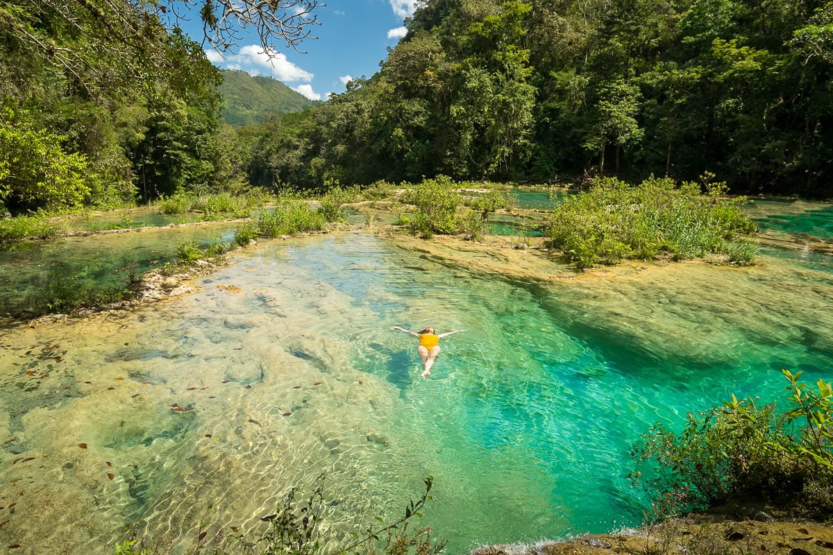 Floating on my back in the clear waters of Semuc Champey, Guatemala.