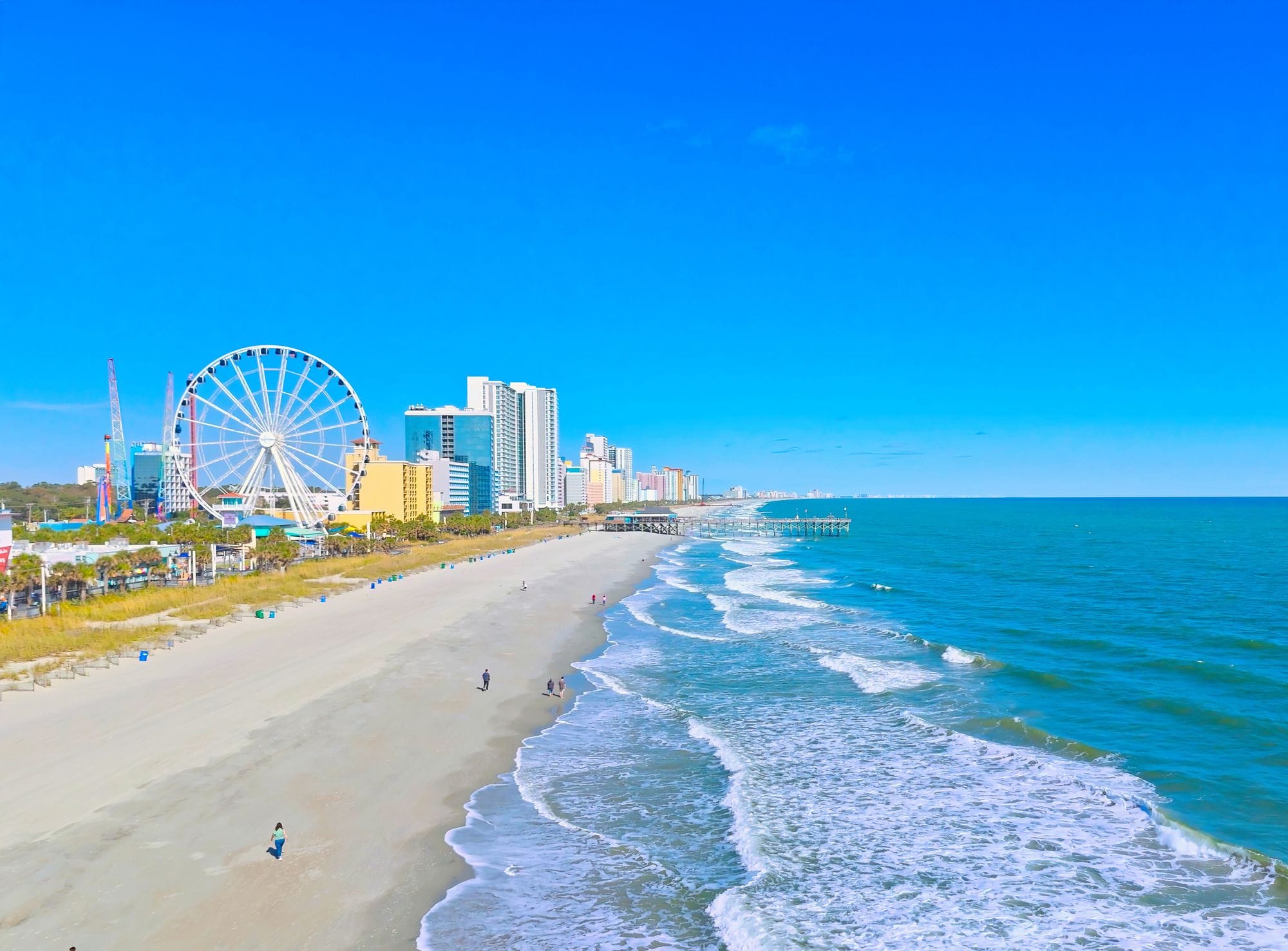 The beach in Myrtle Beach with the Ferris wheel in the background.