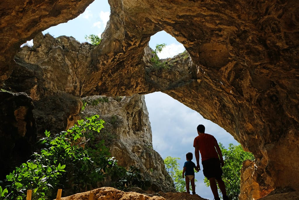 Father and son side a cave inside of Duna-Ipoly National Park