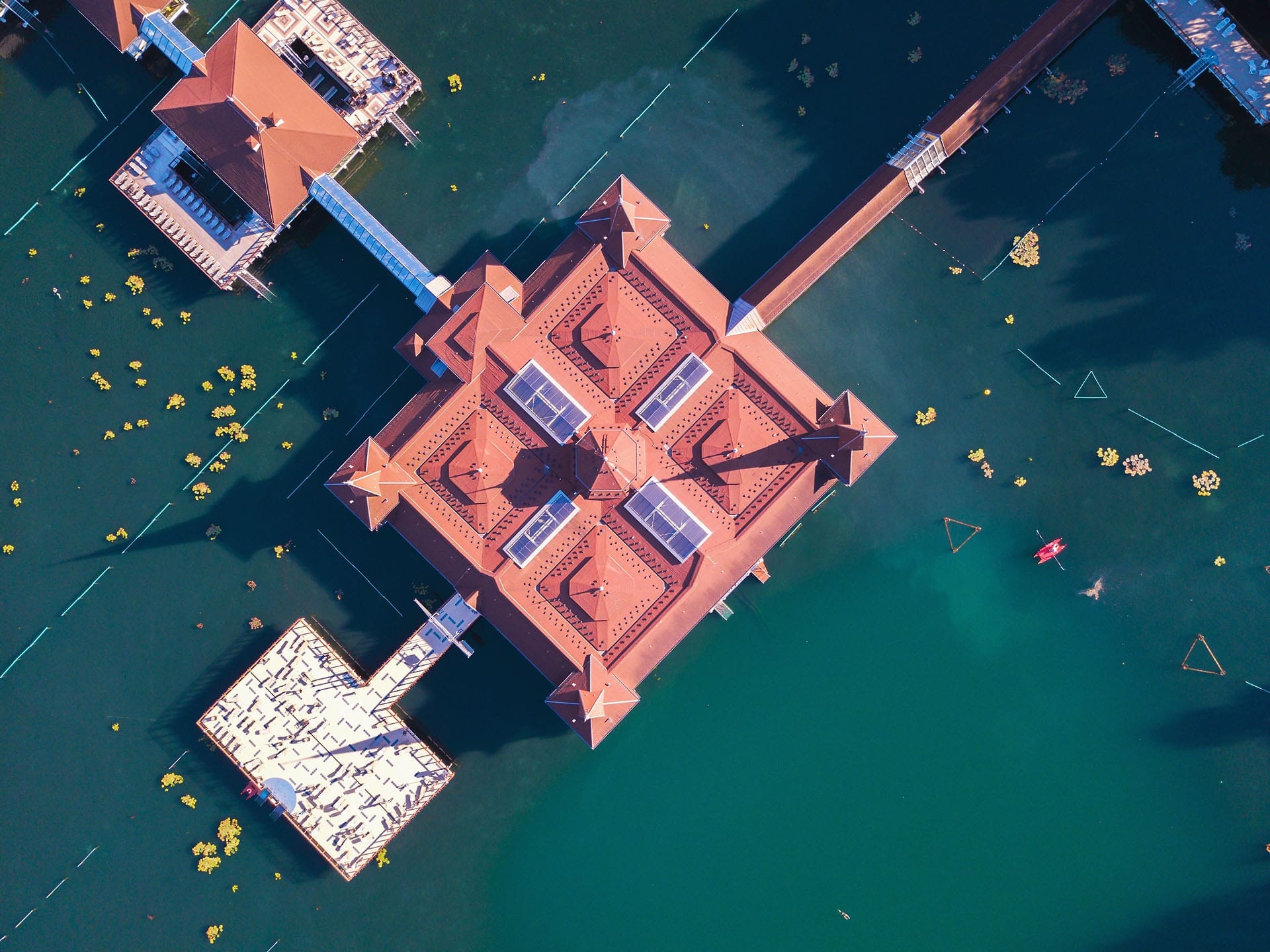 Lake Hévíz resort from above surrounded by water.