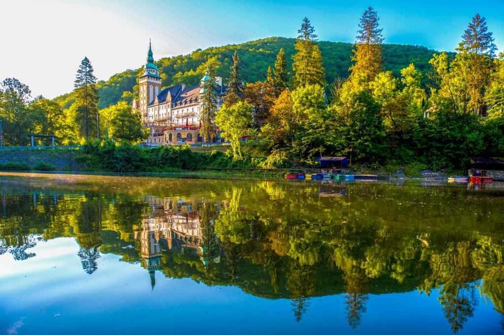 Lillafüred lake with reflection of building on water.