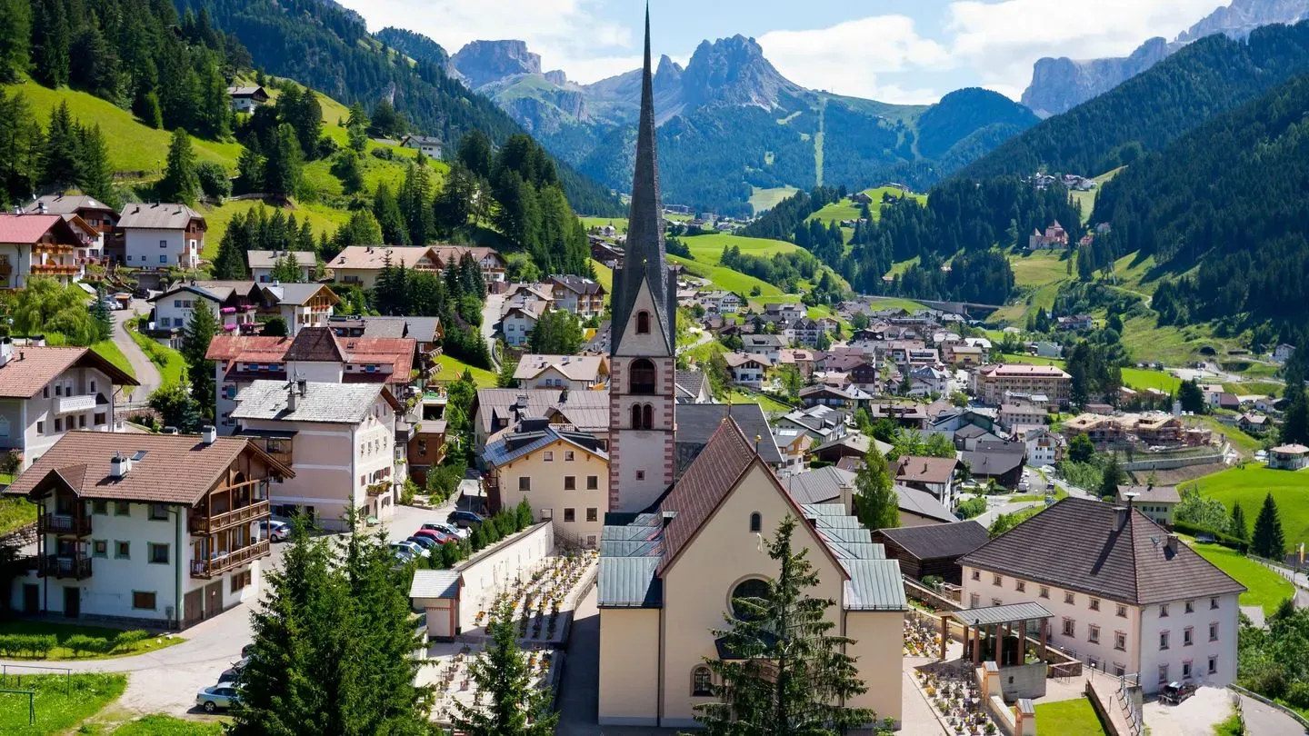 Urtijëi village in Italy sits down in the mountains.