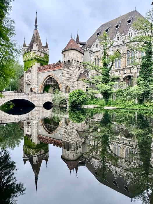Vajdahunyad Castle in Budapest, Hungary reflecting off the water.