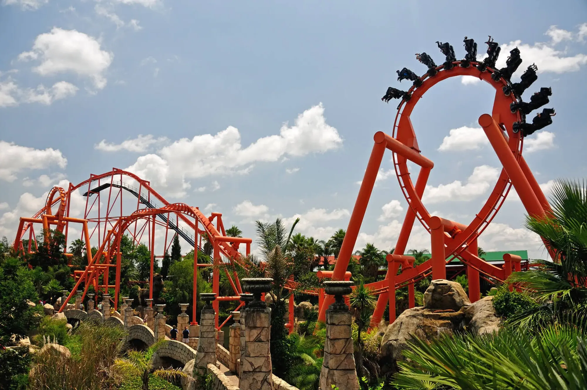 Roller Coaster going upside down with people at Gold Reef City in South Africa.