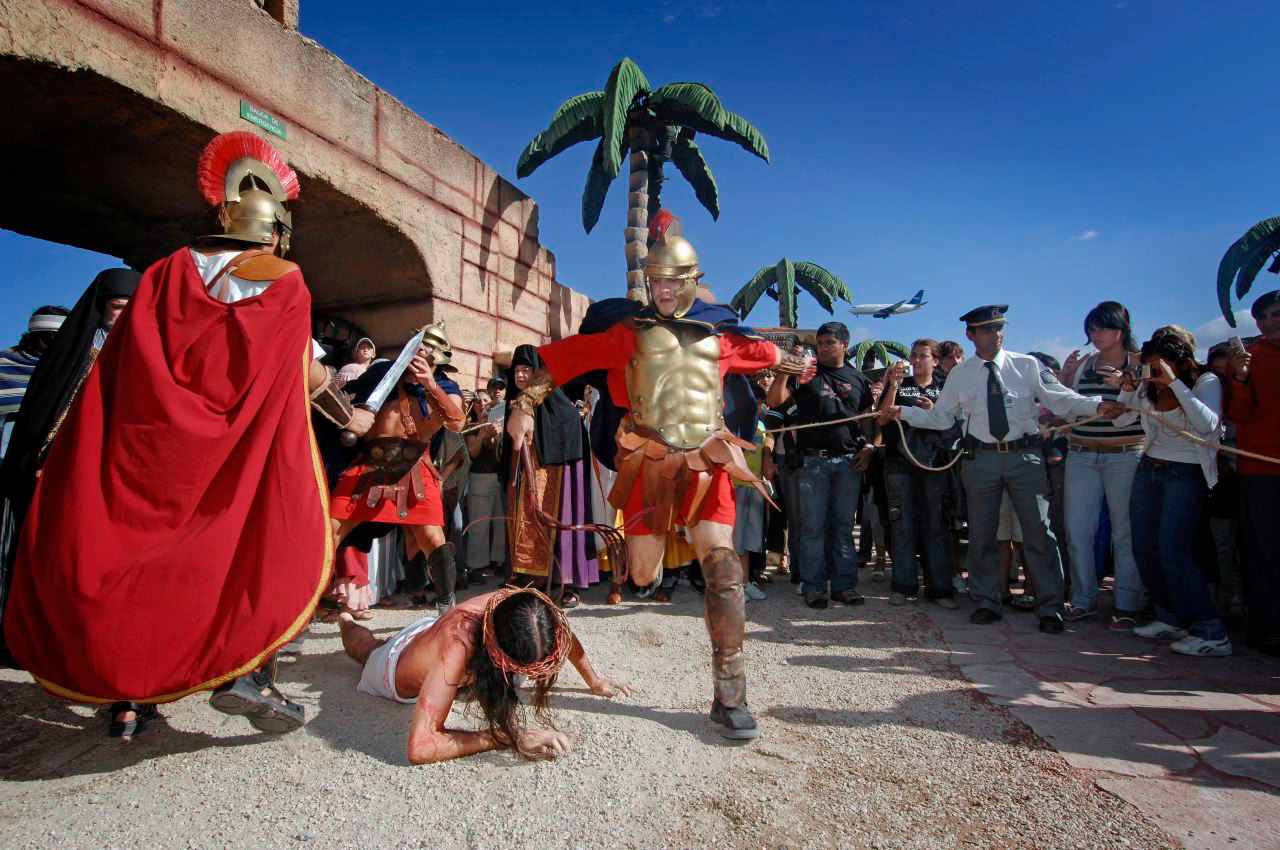 Roman kicking a guy during a reenactment inside Tierra Santa theme park in Buenos Aires, Argentina