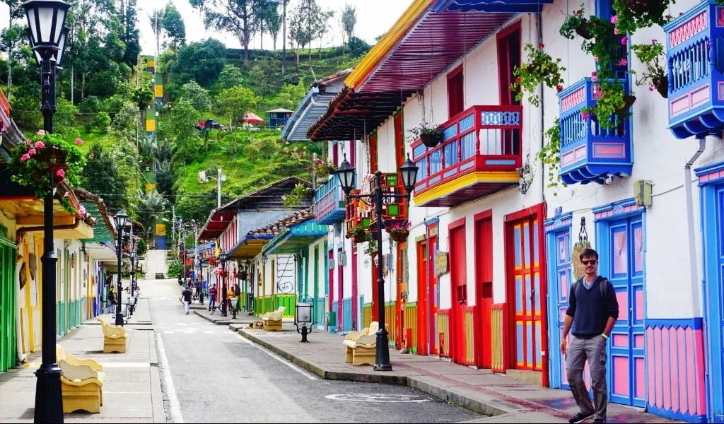 Man walking the colorful streets in Salento, Colombia.