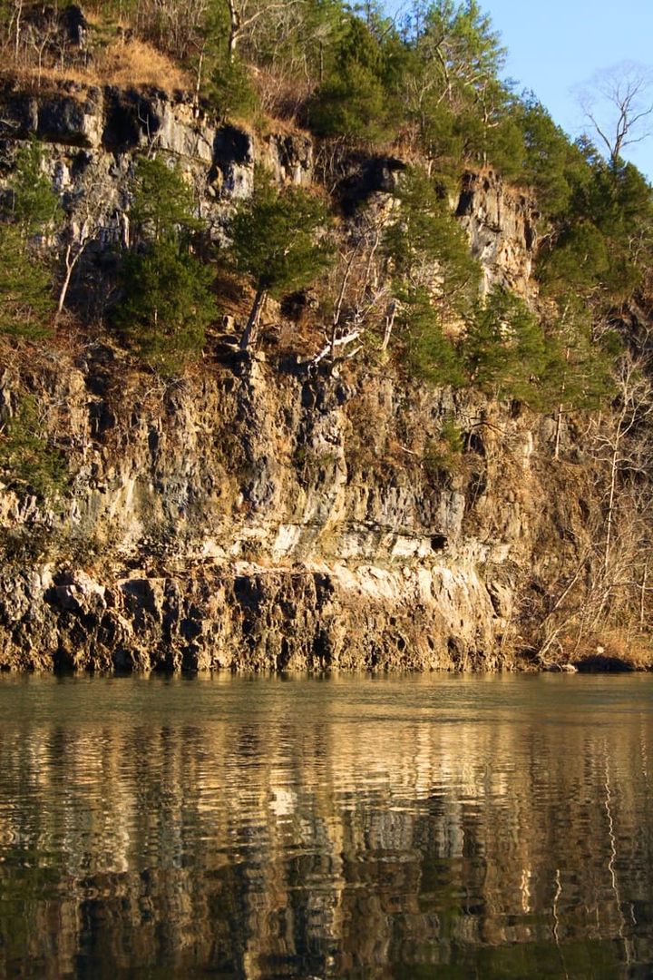 Bass Rock is a large cliff towering out of a river in current river near Van Buren, Missouri
