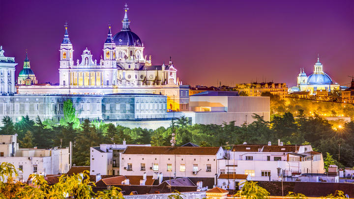 Catedral de la Almudena Madrid, Spain at night lit up with lights.
