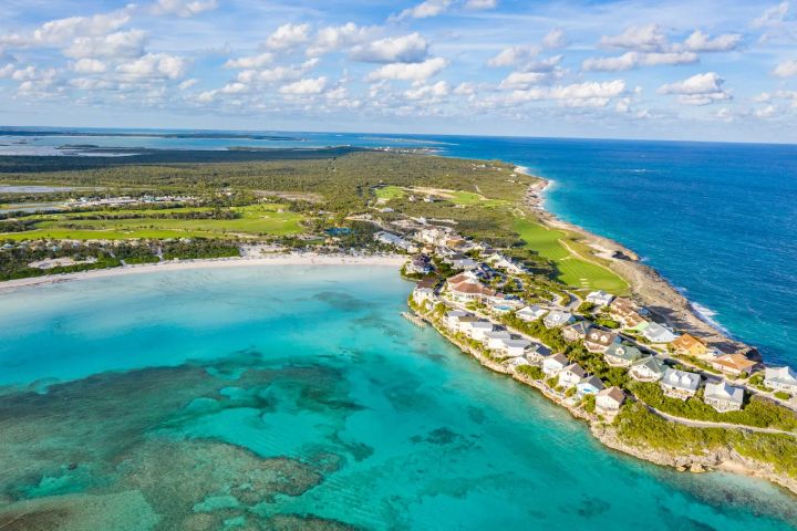 Ariel view of homes and a beach on Great Abaco Island, Bahamas. 