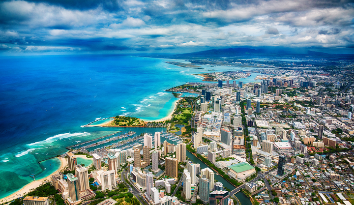 Ariel View of Honolulu with beautiful ocean views on a cloudy day.