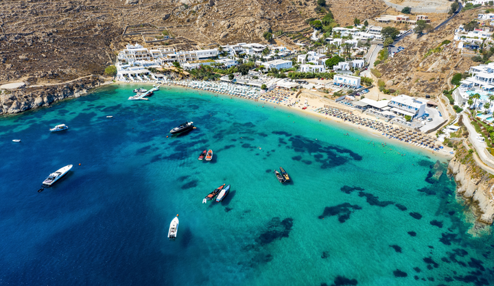 Psarou beach ariel view in Mykonos, Greece has beautiful clear waters.