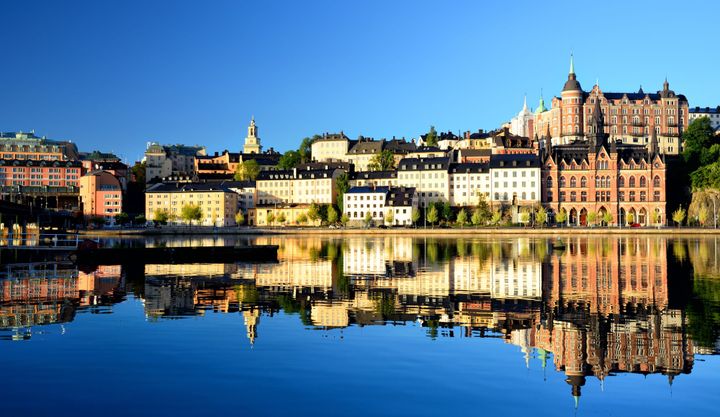 Buildings on the waterfront reflecting off the water in Södermalm island, Stockholm