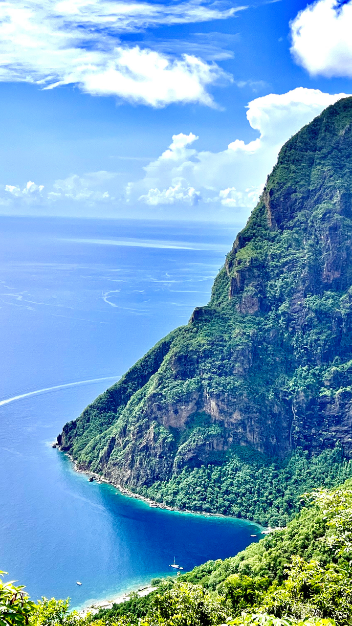 Ariel view of a large mountain and ocean on the island of St. Lucia.