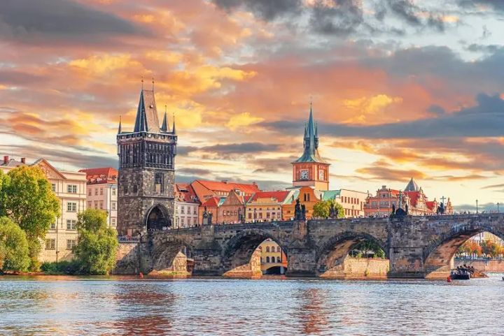 St. Charles Bridge and Prague Castle at sunset.