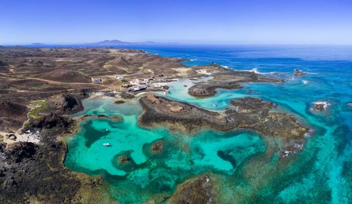 Clear blue waters seen from an ariel view of the Canary Islands.