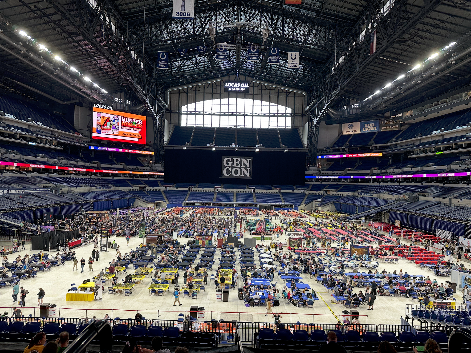 Hundreds of tables on the floor of an enormous sports arena.