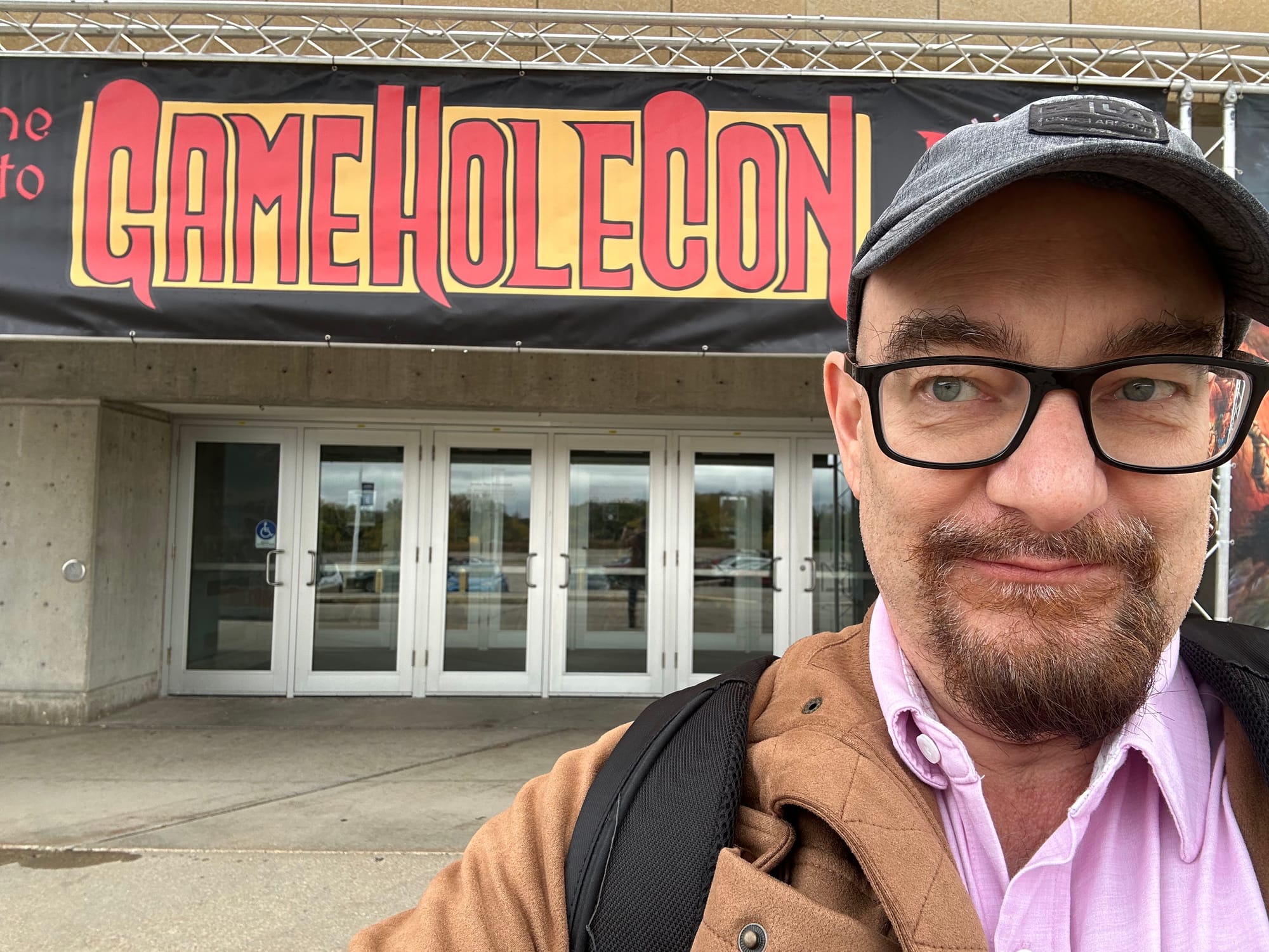 me, standing in front of the entrance to GameHoleCon