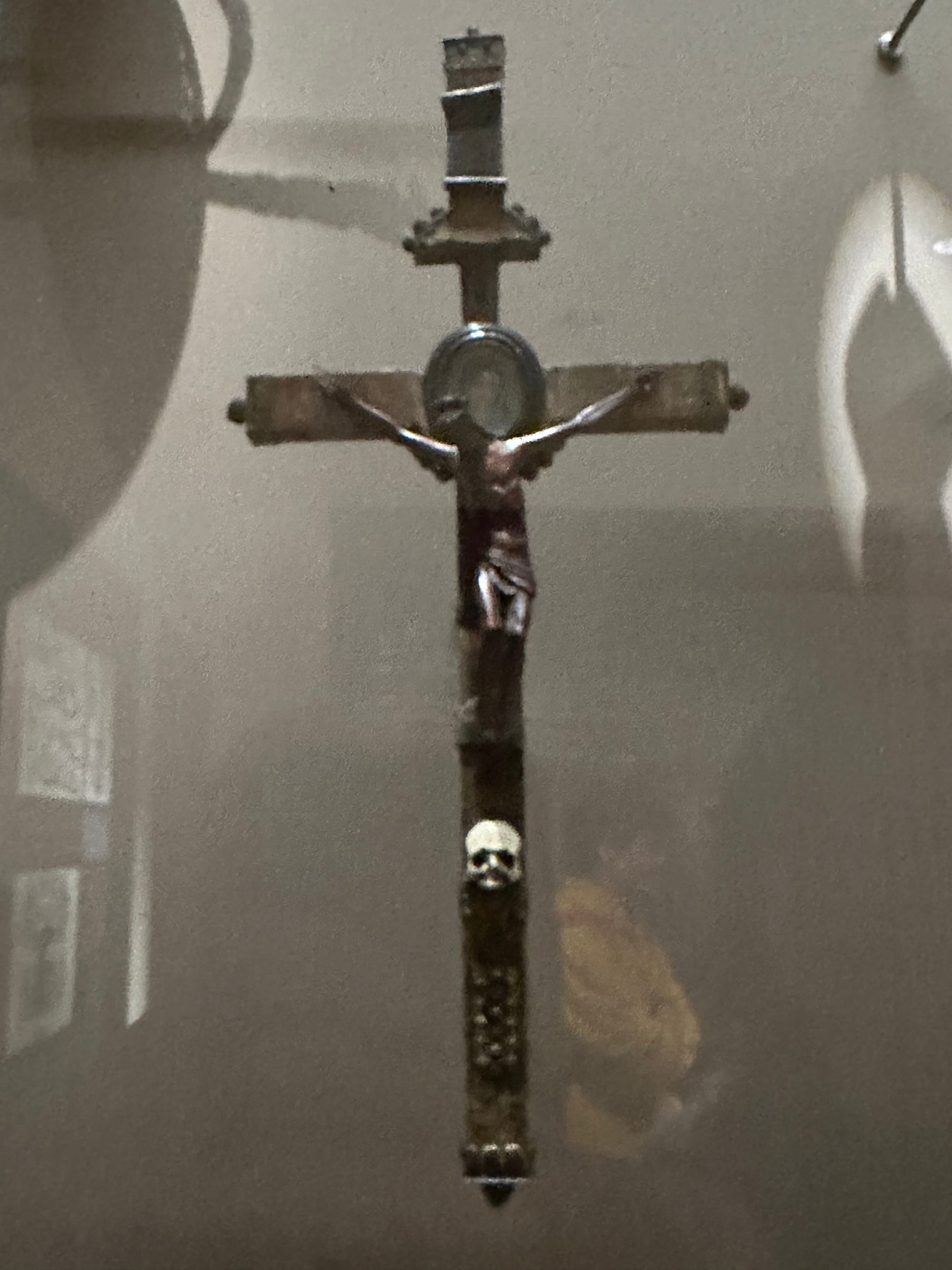 A dagger with a sheath that is a crucifix, only there's a death skull below Christ.