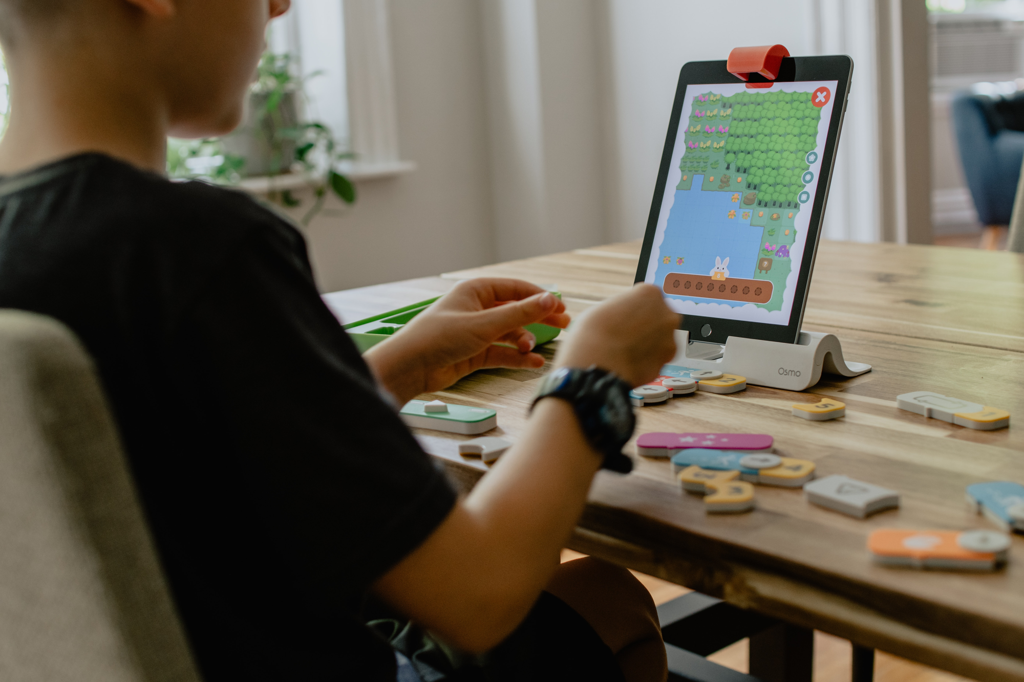 person with app - Best Coding Apps for Kids