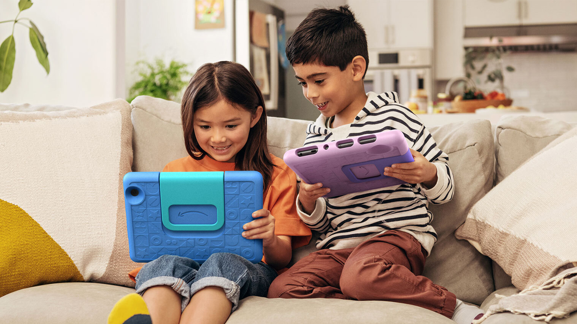 Boy on Couch WIth Sibling - Language Learning Apps for Kids