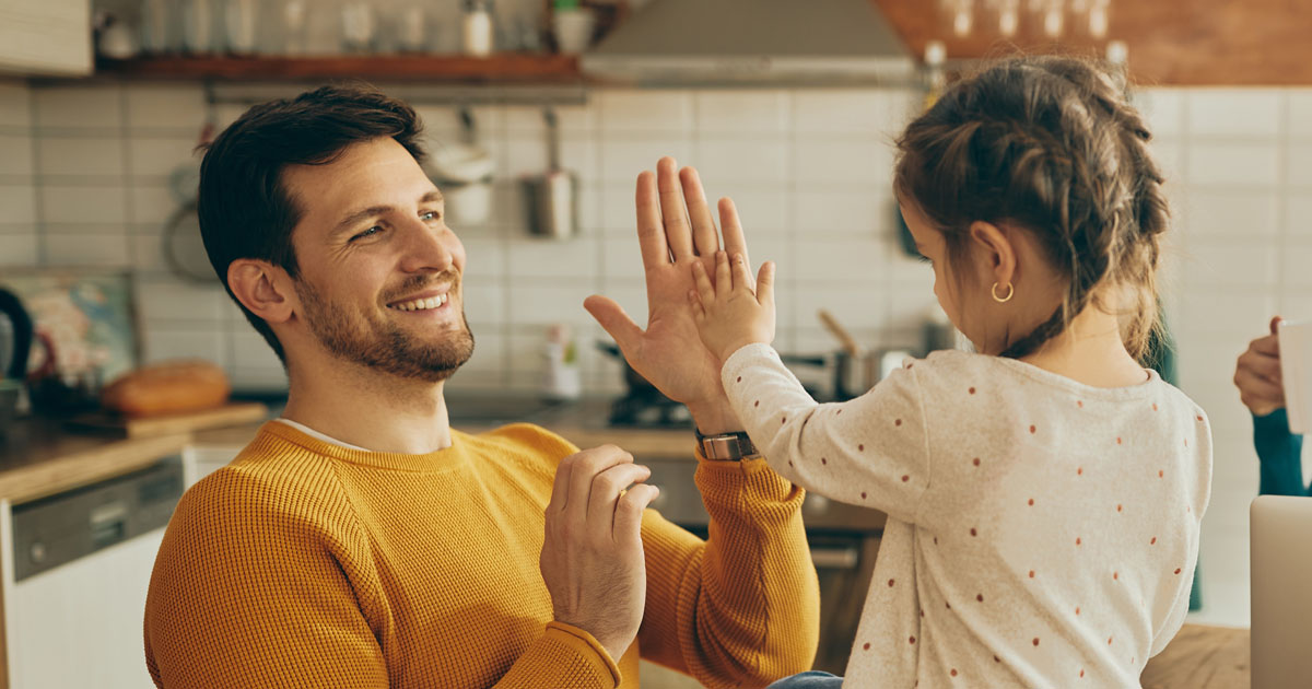 Dad Highfiving Child - Therapeutic Parenting